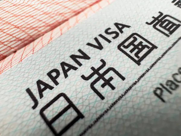 Dünya seyahati için pasaport, Japonya vizesi, tur, havaalanı, gümrük, haber, kapalı sınırlar, uyruk. Makro fotoğraf. Yüksek kalite fotoğraf