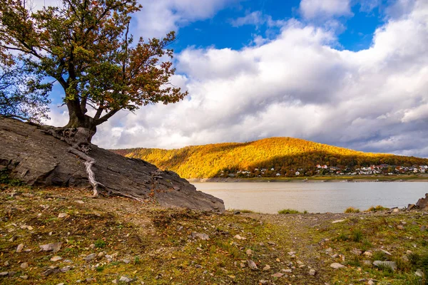 stock image Autumn hike along the Eder dam to the sunken city of Lake Eder Atlantis - Edertal - Hesse - Germany