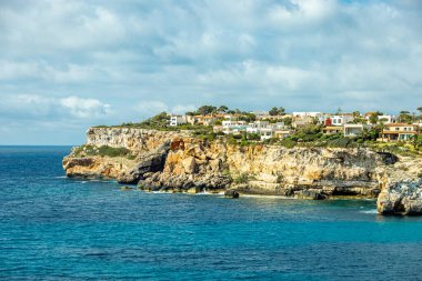 Short but beautiful hike to the Es Ponts rock gate and the coastal town of Santany in the south of the Balearic island of Mallorca - Spain
