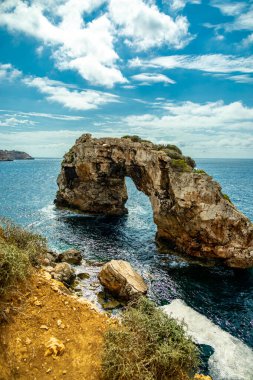 Short but beautiful hike to the Es Ponts rock gate and the coastal town of Santany in the south of the Balearic island of Mallorca - Spain