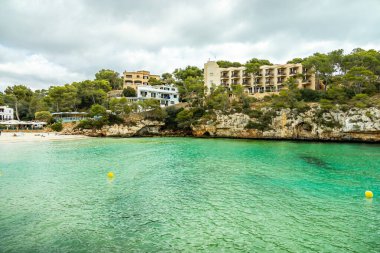Short but beautiful hike to the Es Ponts rock gate and the coastal town of Santany in the south of the Balearic island of Mallorca - Spain