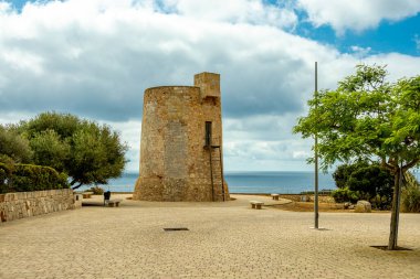 Short but beautiful hike to the Es Ponts rock gate and the coastal town of Santany in the south of the Balearic island of Mallorca - Spain