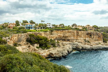 Short but beautiful hike to the Es Ponts rock gate and the coastal town of Santany in the south of the Balearic island of Mallorca - Spain