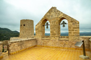 Travelling inland on the beautiful and sunny Balearic island of Mallorca to the Castell de Capdepera - Spain clipart