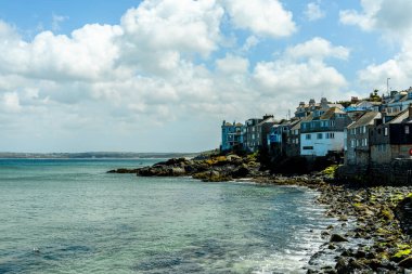 A relaxing day on the beach in front of St Ives Bay in beautiful Cornwall - United Kingdom clipart