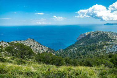 Hike to the Talaia d'Alcdia mountain and viewpoint with a fantastic view of the bay of Alcdia on the Balearic island of Mallorca - Spain clipart