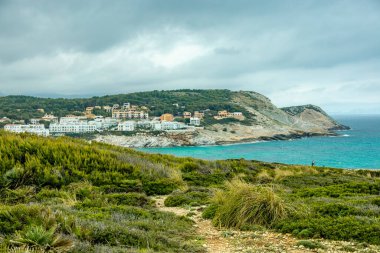 Hike to the Talaia de son Jaumell mountain and viewpoint just outside the town of Cala Rajada - Mallorca - Spain clipart