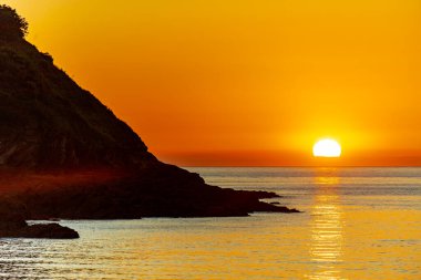 A fantastic sunset on the North Devon coast near Watermouth - United Kingdom clipart