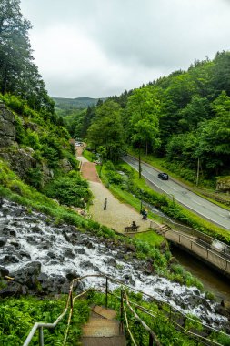 A springtime hike around the tourist attraction in Brotterode-Trusetal - the Trusetal waterfall - Thuringia - Germany clipart