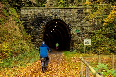 An autumn cycle tour through the Thuringian Forest on the Mommelstein cycle path between Schmalkalden and Brotterode - Thuringia - Germany clipart