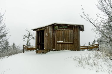 A winter hike to Rennsteig railway station in the snow-covered Thuringian Forest - Schmiedefeld - Thuringia - Germany clipart