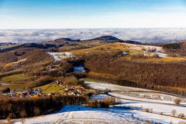 Short winter hike on a sunny day around the Wasserkuppe in the beautiful Rhn - Hesse - Germany clipart