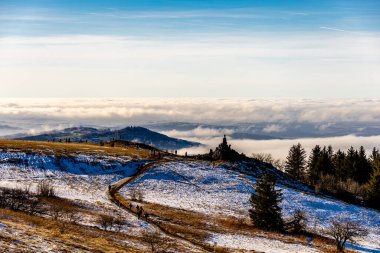 Short winter hike on a sunny day around the Wasserkuppe in the beautiful Rhn - Hesse - Germany clipart