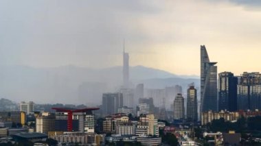 Kuala Lumpur, Malaysia - January 1, 2023 - Time-lapse 4k UHD footage of cityscape of Kuala Lumpur, Malaysia during raining monsoon season 