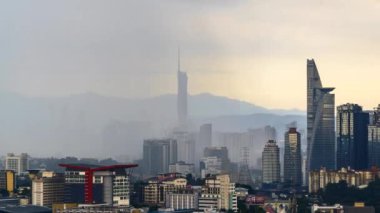 Kuala Lumpur, Malaysia - January 1, 2023 - Time-lapse 4k UHD footage of cityscape of Kuala Lumpur, Malaysia during raining monsoon season 