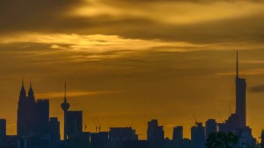 Kuala Lumpur city view from during sunset overlooking the KL city skyline with beautiful ray of lights in Malaysia