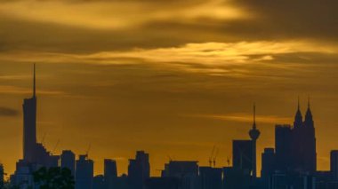 Kuala Lumpur city view from during sunset overlooking the KL city skyline with beautiful ray of lights in Malaysia