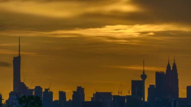 Kuala Lumpur city view from during sunset overlooking the KL city skyline with beautiful ray of lights in Malaysia