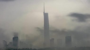 KUALA LUMPUR, MALAYSIA - Jan 23, 2023: Warisan PNB118 building during sunset dawn heavy cloud, and monsoon rain