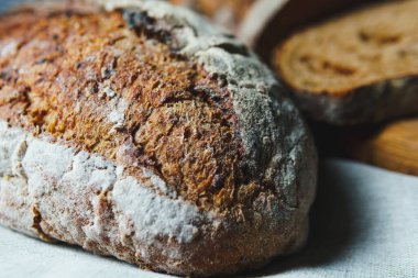 Freshly baked bread with a golden crust close up. Yeast dough. Concept of bakery products, bakery and healthy eating