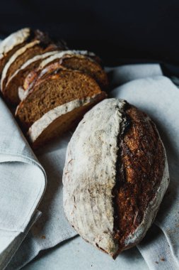 Freshly baked bread with a golden crust close up. Yeast dough. Concept of bakery products, bakery and healthy eating