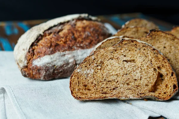 Freshly baked bread with a golden crust close up. Yeast dough. Concept of bakery products, bakery and healthy eating