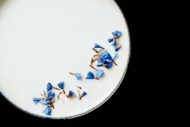 Alcoholic drink. A cocktail with elite alcohol on dark black background, close-up. Concept of  nightlife and exotic drinks.