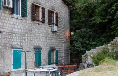 Kotor's narrow cobblestone streets and historic stone houses, a UNESCO World Heritage site. Old town architecture details. clipart