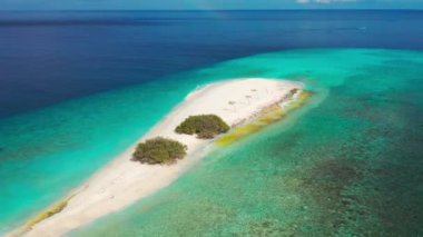 Aerial view of sandbar and blue sea. Maldivian sandbank in Indian ocean, white sandy coast crystal azure color water, perfect getaway for tropical vacations