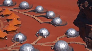 Ürdün 'ün Wadi Rum kentindeki kızıl çöl manzarasında Mars kolonisini andıran gelecekteki kubbe yapılarının genel görünümü.