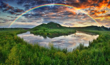 Landscape with a Rainbow on the River in Spring. colorful morning. nature of Ukraine