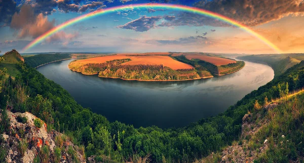 stock image colorful rainbow over the river canyon. spring morning