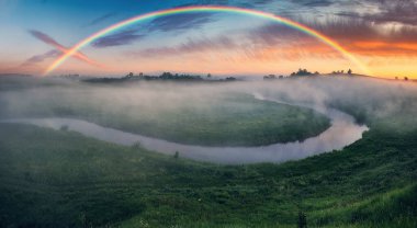 Landscape with a Rainbow on the River in Spring. colorful morning. nature of Ukraine