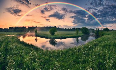 Landscape with a Rainbow on the River in Spring. colorful morning. nature of Ukraine