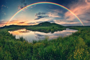 Landscape with a Rainbow on the River in Spring. colorful morning. nature of Ukraine