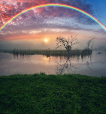 Landscape with a Rainbow on the River in Spring. colorful morning. nature of Ukraine