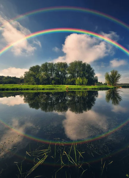 Landscape with a Rainbow on the River in Spring. colorful morning. nature of Ukraine