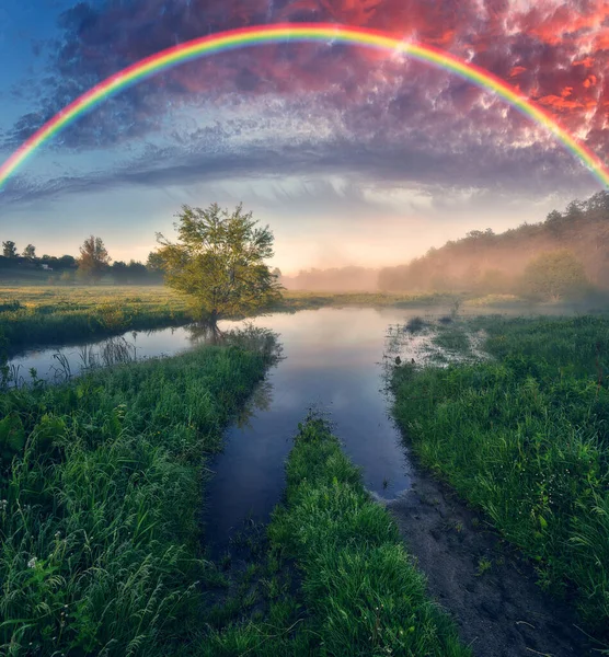 Landscape with a Rainbow on the River in Spring. colorful morning. nature of Ukraine