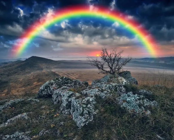 Rainbow with clouds over a rock. nature of Ukraine