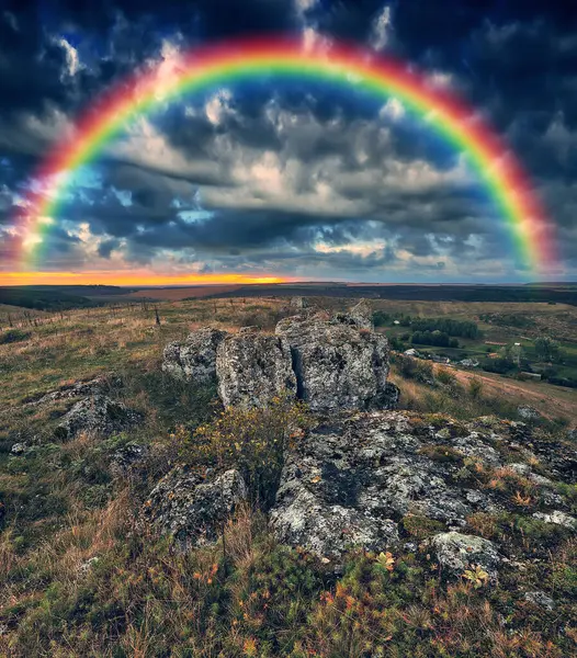 Rainbow with clouds over a rock. nature of Ukraine