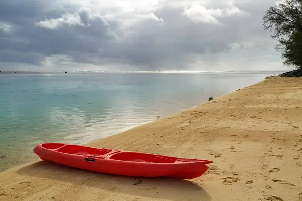 An ocean kayak on the beach beside Aroa Lagoon, Rarotonga, Cook Islands