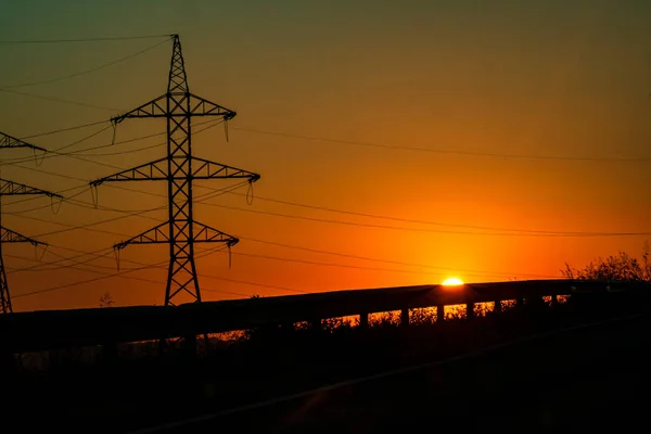 stock image Electric power pylon, electric tower at sunset