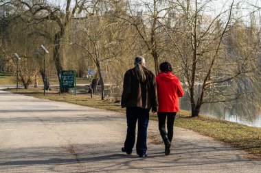 People and tourists wander the streets of the Bucharest Old Town, Romania, 2022