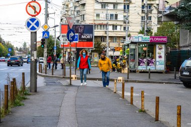 People and tourists wander the streets of the Bucharest Old Town, Romania, 2022