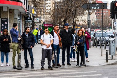 People and tourists wander the streets of the Bucharest Old Town, Romania, 2022