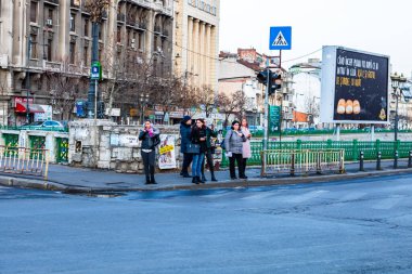 People and tourists wander the streets of the Bucharest Old Town, Romania, 2022