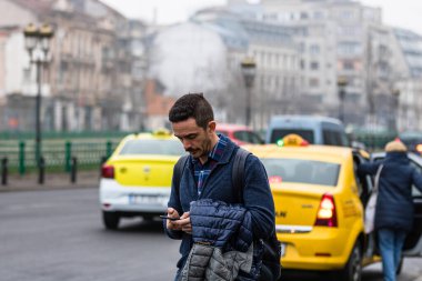 People and tourists wander the streets of the Bucharest Old Town, Romania, 2022