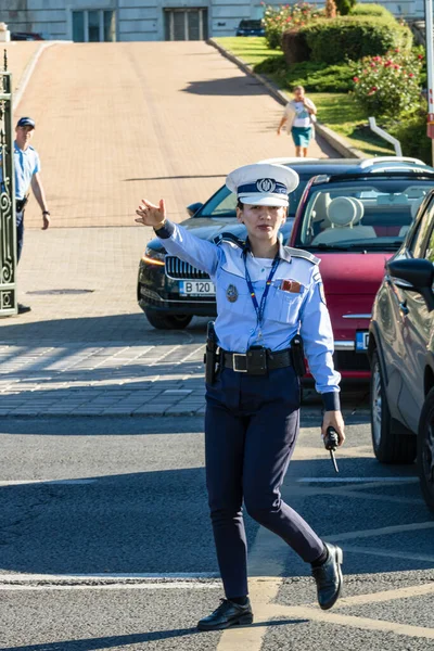 stock image Police agent, Romanian Traffic Police (Politia Rutiera) directing traffic. Rush hour in Bucharest, Romania, 2022