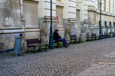 People and tourists wander the streets of the Bucharest Old Town, Romania, 2022