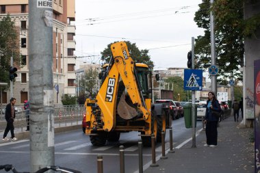 Construction workers at construction site and heavy duty bulldozer in Bucharest, Romania, 2023